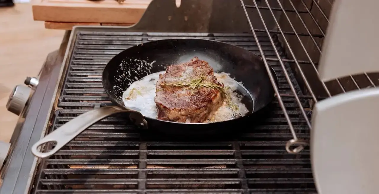 carbon steel frying pan steak on grill